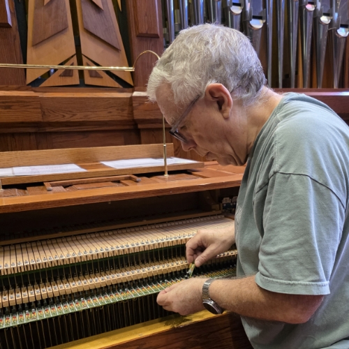 Andrew Walker repairing an organ