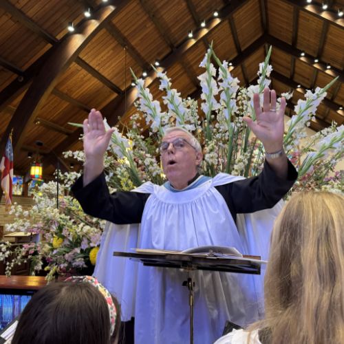 Andrew Walker conducting a church congregation