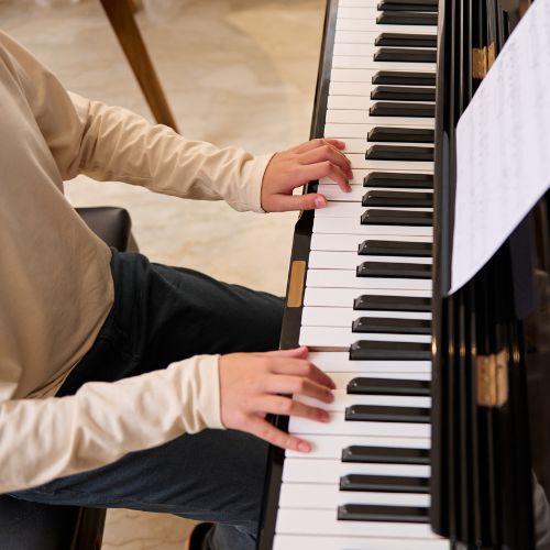 piano student at the keyboard